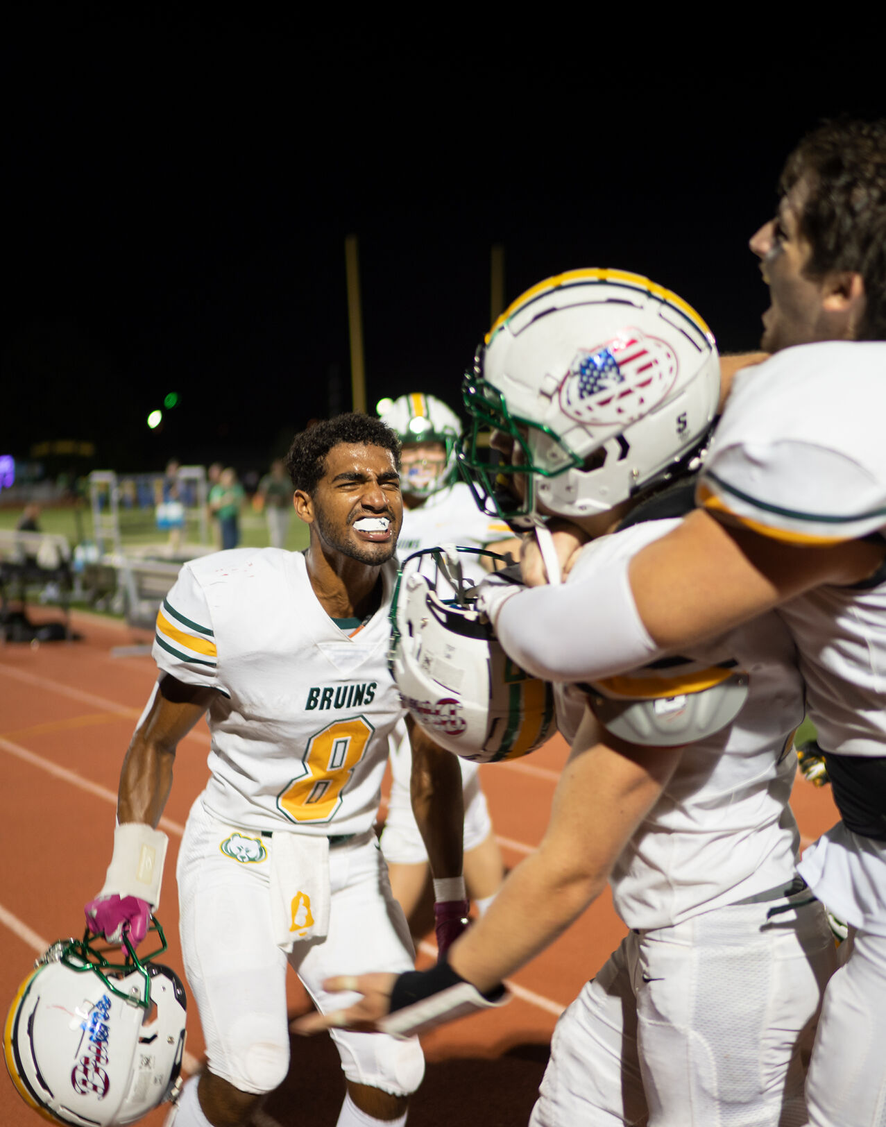 Members of the Rock Bridge football team cheer